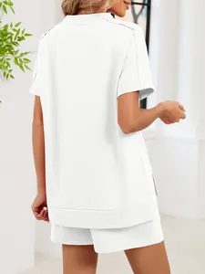 Back view of a white two-piece lounge set featuring a loose T-shirt and matching shorts