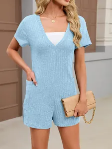 Macro detail of light blue ribbed V-neck short-sleeved romper with pockets