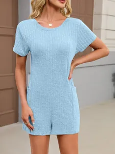 Detail view of light blue ribbed knit short sleeve romper with side pockets