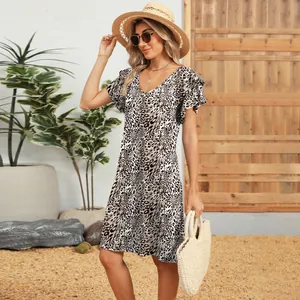 Detailed view of leopard print summer dress with ruffled sleeves and V-neckline