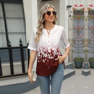 Detail of V-neck floral print chiffon blouse with delicate lace patchwork sleeves