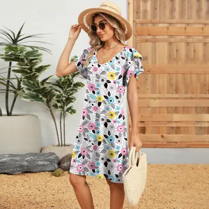 Full length view of a woman wearing a V-neck floral print dress with ruffle sleeves.