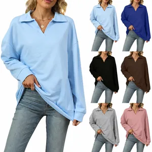 Detailed view of women's oversized V-neck polo sweaters in multiple color options
