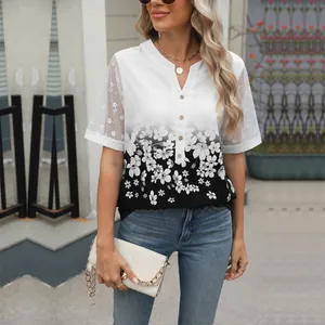 Detailed view of women's V-neck floral chiffon top with delicate lace patchwork sleeves