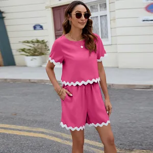 Summer pink two-piece set featuring stylish scalloped trim details for women.