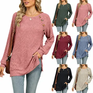 Loose round neck long sleeve top for women with ribbed texture and side button details