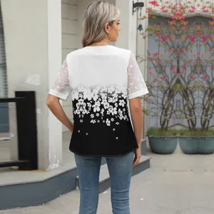 Detailed back view of floral print chiffon top with elegant white lace sleeves