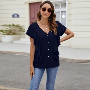 Elegant navy blue flutter sleeve blouse featuring a button-down front and V-neckline