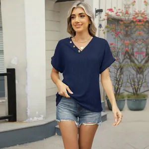 Close-up of navy V-neck short sleeve T-shirt with hollow-out jacquard and button detail