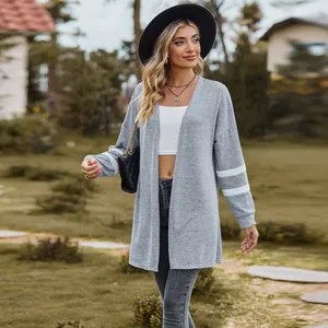 Grey long-sleeved knit cardigan with white sleeve stripes for a stylish autumn look