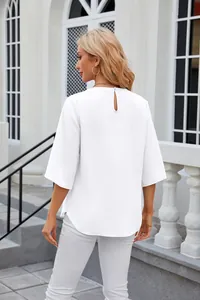 Back view of a loose white chiffon blouse with round neck and five-point sleeves.