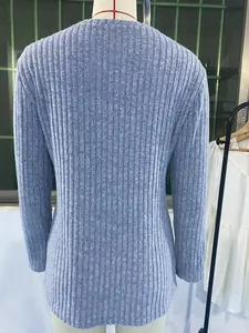 Detailed back view of a light blue ribbed long-sleeve T-shirt with elegant tulip hem