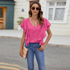 Detailed look at the vibrant pink flutter sleeve shirt with delicate front buttons