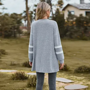 Detailed back view of a grey long-sleeved knit cardigan with white contrast stripes