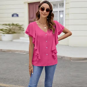 Detailed view of women's vibrant pink flutter sleeve blouse with ruffle accents and buttons