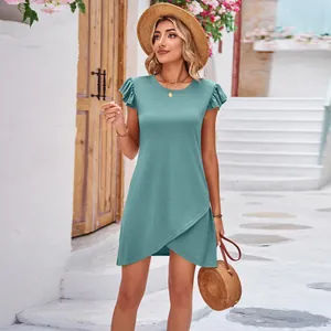 Detailed view of turquoise summer dress with ruffle sleeves and overlap skirt design.
