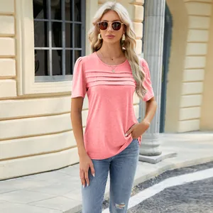 Detailed view of a coral pink short-sleeve T-shirt featuring pleated chest design