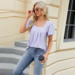 Lavender eyelet square neck blouse with pleated details shown on a model outdoors.