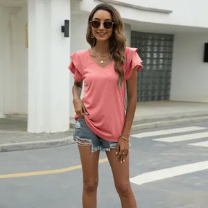 Fashionable pink V-neck top showing double-layered ruffle sleeve details in outdoor setting