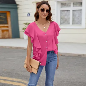 Detail of a bright pink V-neck blouse with ruffled sleeves and button closure