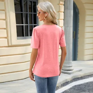 Stylish pink short sleeve t-shirt for women featuring delicate puff shoulder details