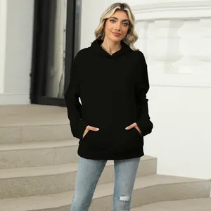 Casual black oversized hooded sweatshirt for women featuring a functional kangaroo pocket.