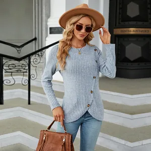 Detail view of women's ribbed long sleeve top featuring a unique tulip hem and side buttons.