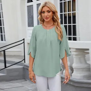 Front view of an elegant sage green chiffon blouse featuring pleated neckline and split sleeves