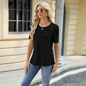 Outdoor lifestyle detail shot of a woman in a black pleated chest short sleeve T-shirt