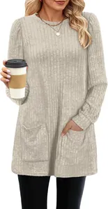 Detailed view of casual women's ribbed knit tunic with puff sleeves and front pockets.