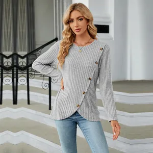 Detail of grey ribbed long sleeve top with unique tulip hem and button accents