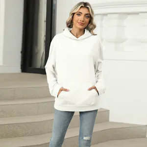 Detailed view of a women's oversized white hooded sweatshirt with a kangaroo pocket