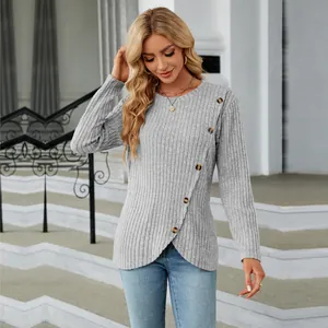 Close-up of grey ribbed long-sleeved shirt with decorative buttons and tulip hem