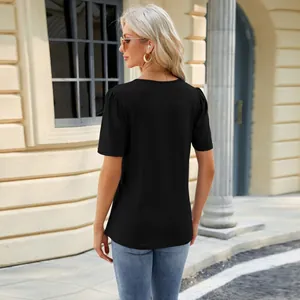 Detail back view of elegant black U-neck short sleeve T-shirt with pleated shoulders