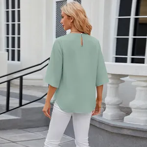 Back view of elegant sage green round neck half sleeve chiffon blouse for women outdoors