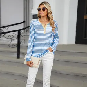 Stylish casual blue and white striped long-sleeve tee featuring yellow V-neck buttons on a model