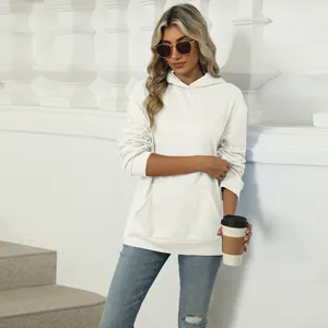 Casual oversized white hoodie for women featuring a front kangaroo pocket and drawstring hood