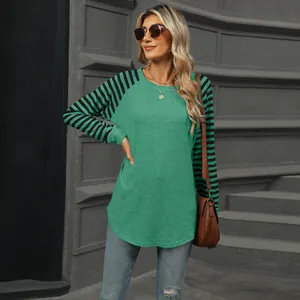 Detail of women's color block striped raglan sleeve t-shirt with swallowtail hem
