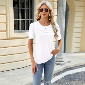 Detailed view of white short-sleeve U-neck t-shirt with front pleats on model.