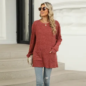 Macro detail of women casual long-sleeved top featuring ribbed texture and front pockets