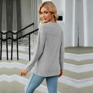 Back view of a grey round neck ribbed knit top featuring a stylish tulip hem design