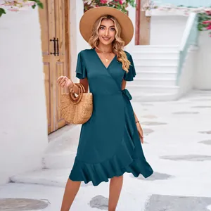 Elegant teal v-neck wrap dress with short sleeves and a ruffled irregular hemline