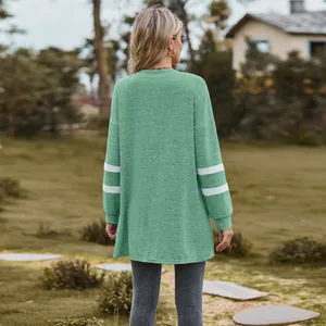 Detailed back view of a mint green long sleeve sweatshirt featuring white stripes on sleeves