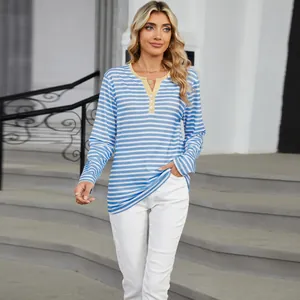 Casual blue and white striped V-neck long sleeve T-shirt for women in a street setting