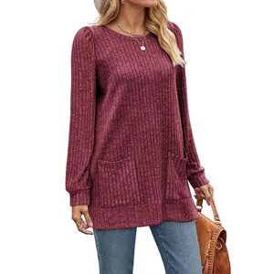 Detail of wine red ribbed knit top with pockets and casual puff sleeves for women