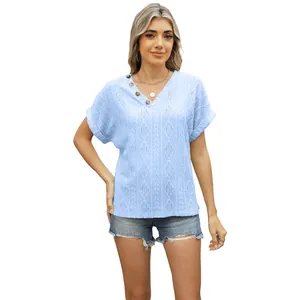 Women's light blue V-neck knit top with decorative buttons and hollow-out pattern