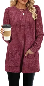 Close-up of maroon ribbed knit tunic top featuring puff sleeves and front pockets