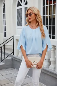 Light blue round neck chiffon blouse with split half sleeves on female model