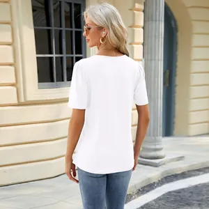 Back view of elegant white short-sleeved t-shirt with pleated shoulders and rounded hem.