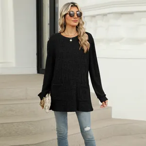 Casual black long sleeve top with pockets and bubble sleeves for autumn and winter.